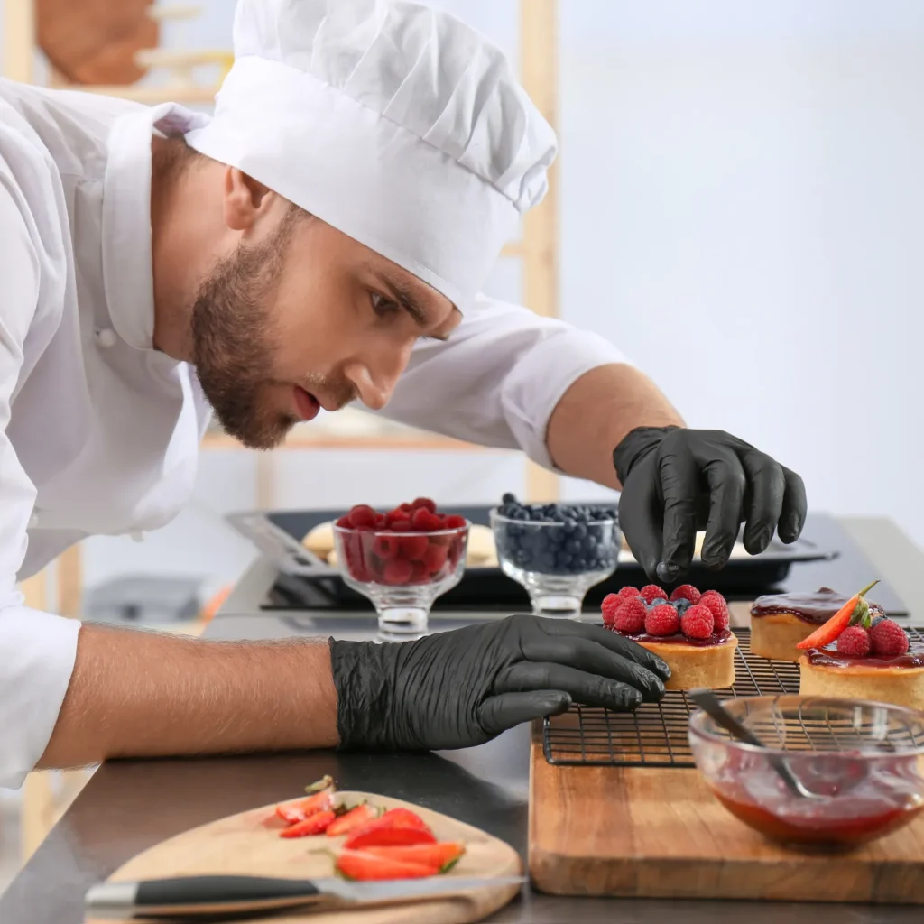 chef preparing berry tart in foodservice