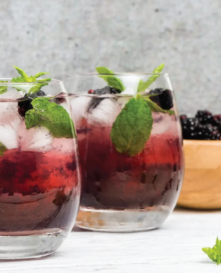 clear glass cups with sparkling blackberry cocktail