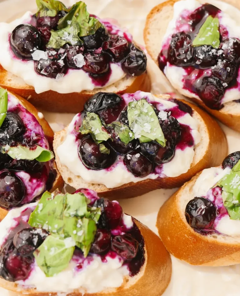 blueberries and bruschetta burrata on white plate